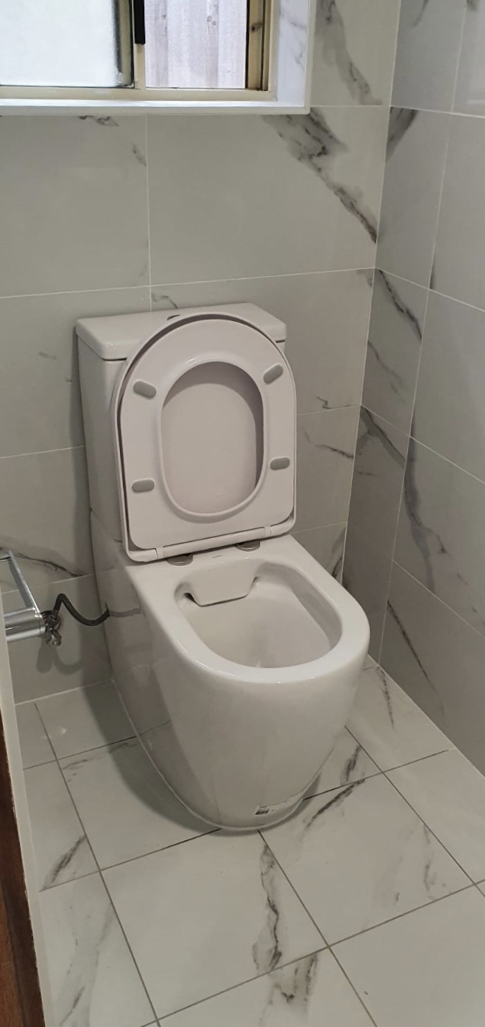 Toilet in laundry area